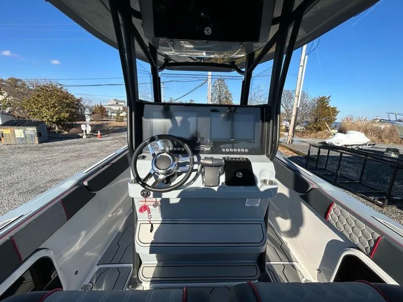 Slide: The Image of 2024 Glasstream 32 GSX boat cockpit with modern steering and controls. - 20