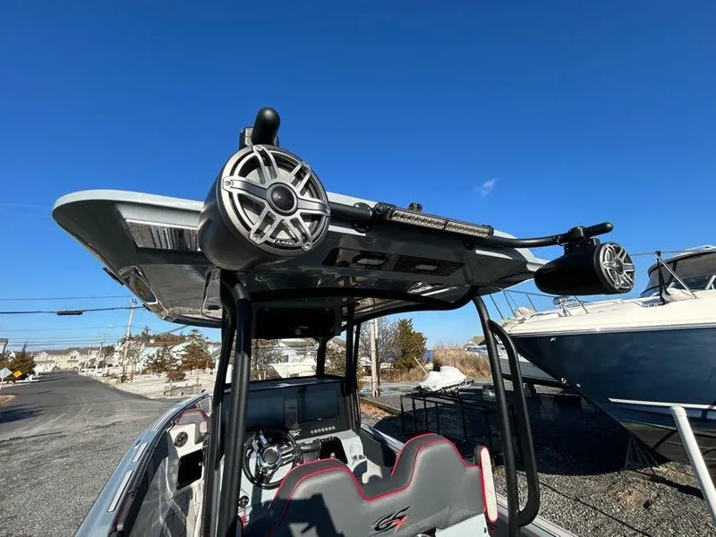Slide: The Image of 2024 Glasstream 32 GSX boat with speakers and seating, under a clear blue sky. - 22