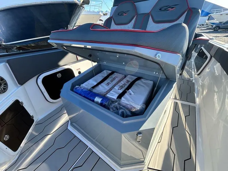 Slide: The Image of 2024 Glasstream 32 GSX boat with open storage compartment under seat. - 31