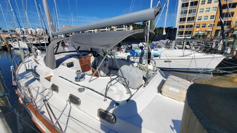 Slide: The Image of 1999 Beneteau Oceanis 44 CC sailboat docked at marina under clear blue sky. - 4