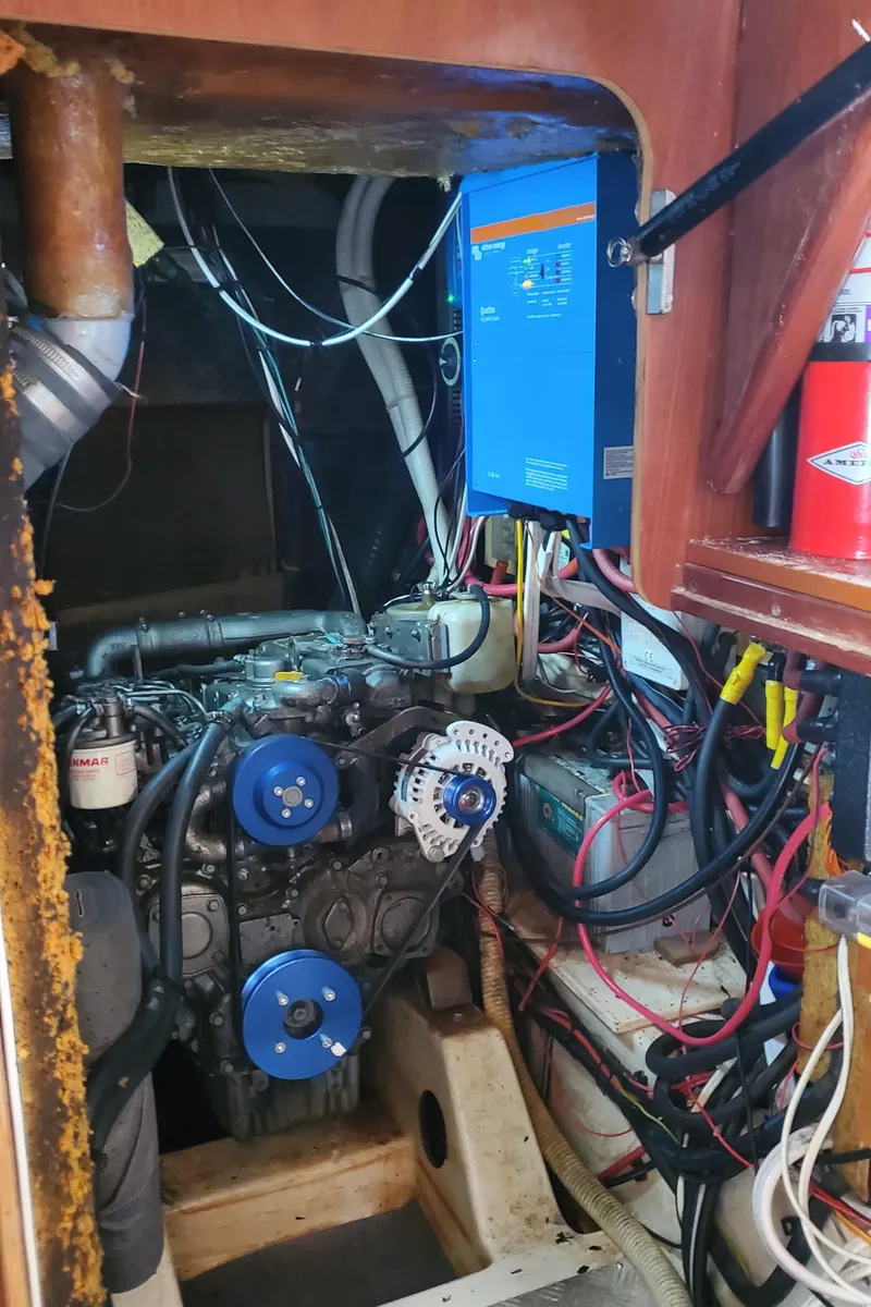 Slide: The Image of Engine room of 1999 Beneteau Oceanis 44 CC sailboat with visible wiring and components. - 40