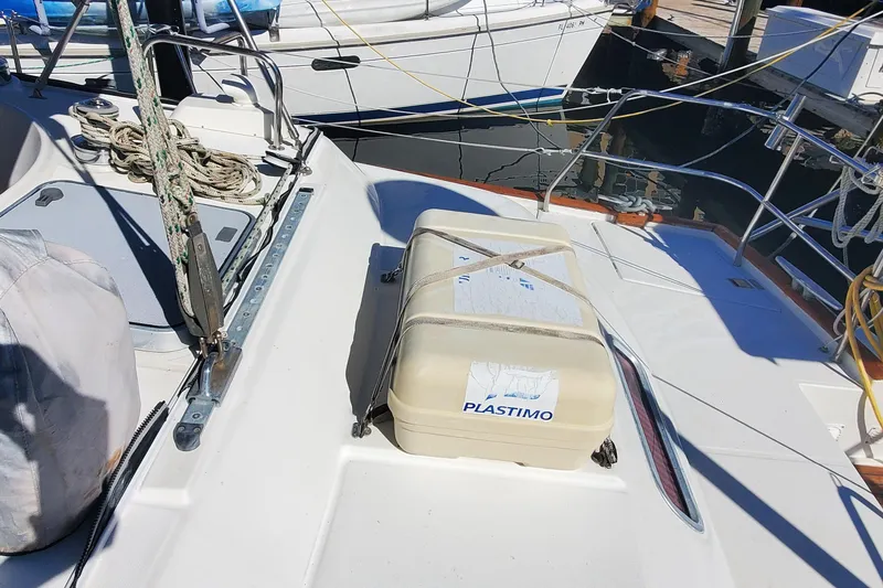 Slide: The Image of 1999 Beneteau Oceanis 44 CC deck with Plastimo equipment, docked at marina. - 48