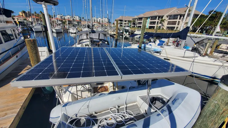 Slide: The Image of Beneteau Oceanis 44 CC 1999 with solar panels docked in a marina. - 5