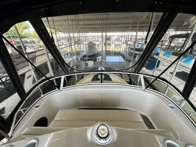 Slide: The Image of 1998 Silverton 372 Motor Yacht interior view, docked in a marina. - 14