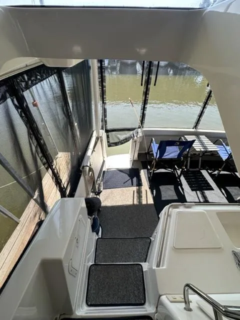 Slide: The Image of 1998 Silverton 372 Motor Yacht interior with seating area and water view. - 16