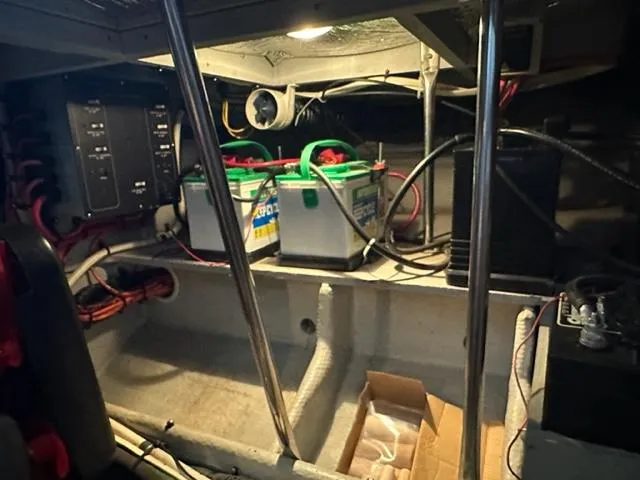 Slide: The Image of Engine room of 1998 Silverton 372 Motor Yacht with batteries and wiring. - 21