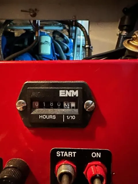 Slide: The Image of Hour meter on a 1998 Silverton 372 Motor Yacht engine panel, showing 1803.1 hours. - 22