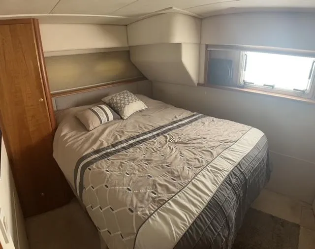 Slide: The Image of Cozy bedroom in 1998 Silverton 372 Motor Yacht with window and stylish bedding. - 29