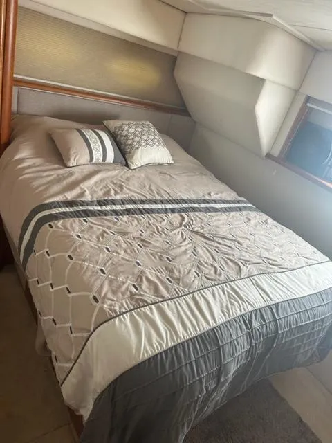 Slide: The Image of Cozy bedroom in 1998 Silverton 372 Motor Yacht with elegant bedding. - 30