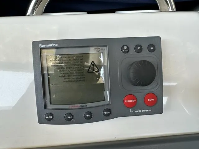 Slide: The Image of Raymarine autopilot control on 1998 Silverton 372 Motor Yacht dashboard. - 37