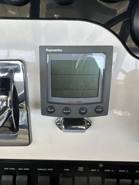 Slide: The Image of 1998 Silverton 372 Motor Yacht dashboard with Raymarine navigation system. - 40