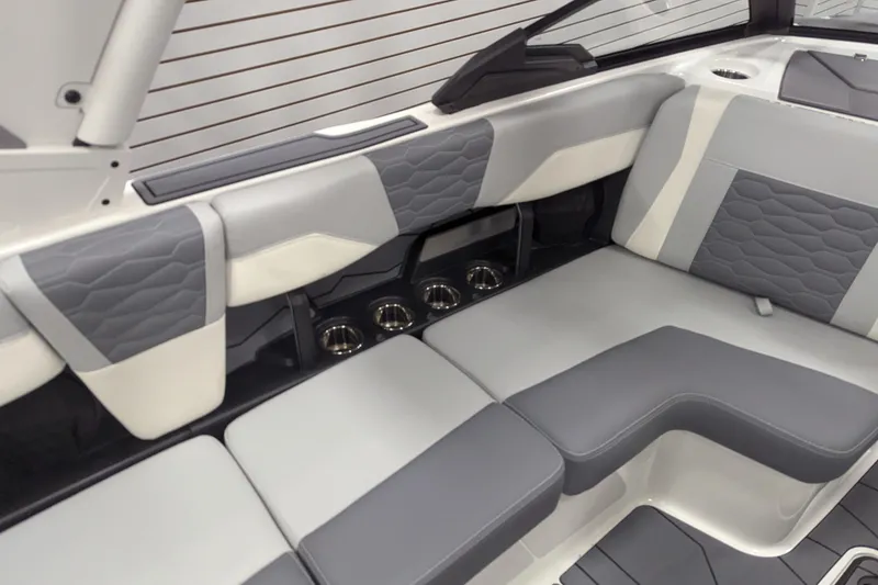 Slide: The Image of 2025 Malibu Wakesetter 24 MXZ interior with gray and white seating, modern design. - 27