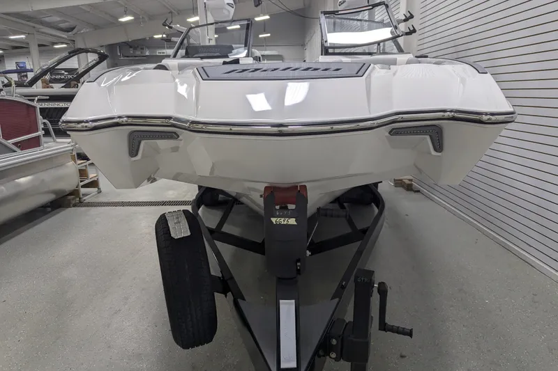 Slide: The Image of 2025 Malibu Wakesetter 24 MXZ boat on trailer in showroom. - 5