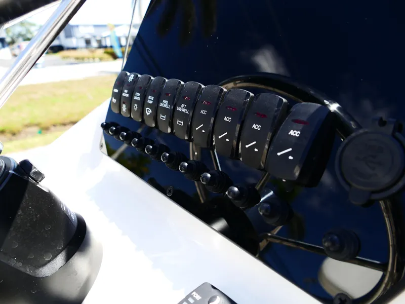 Slide: The Image of 2025 Bulls Bay 2000 boat interior with seating and storage compartments. - 11