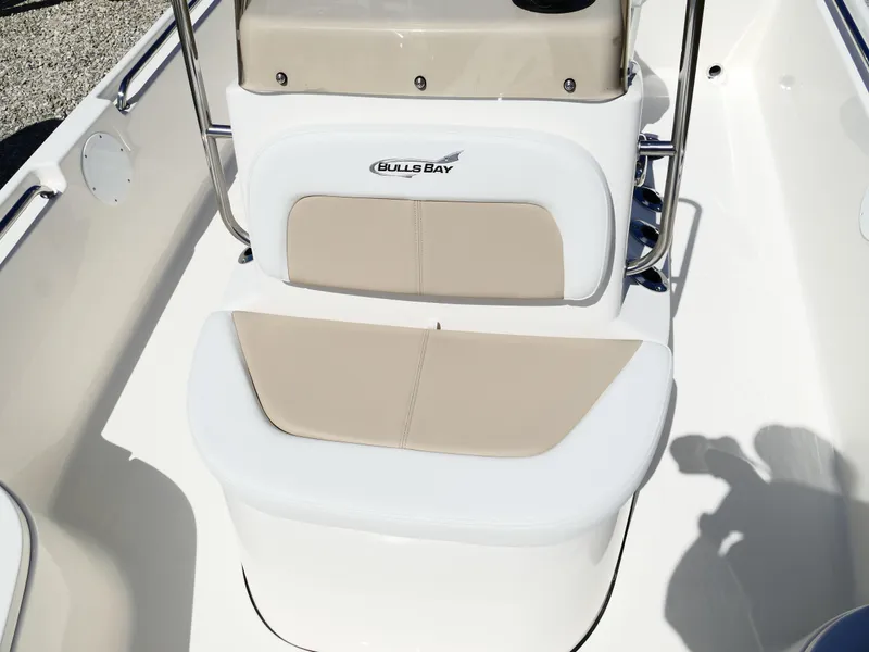 Slide: The Image of 2025 Bulls Bay 2000 boat deck with storage compartments and clean white finish. - 19
