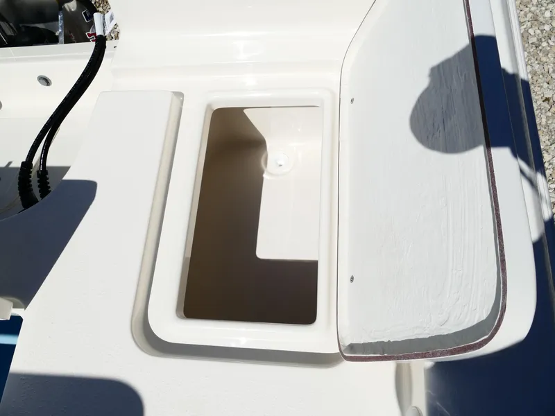 Slide: The Image of 2025 Bulls Bay 2000 boat with beige and white seating, featuring a Suzuki outboard motor. - 27