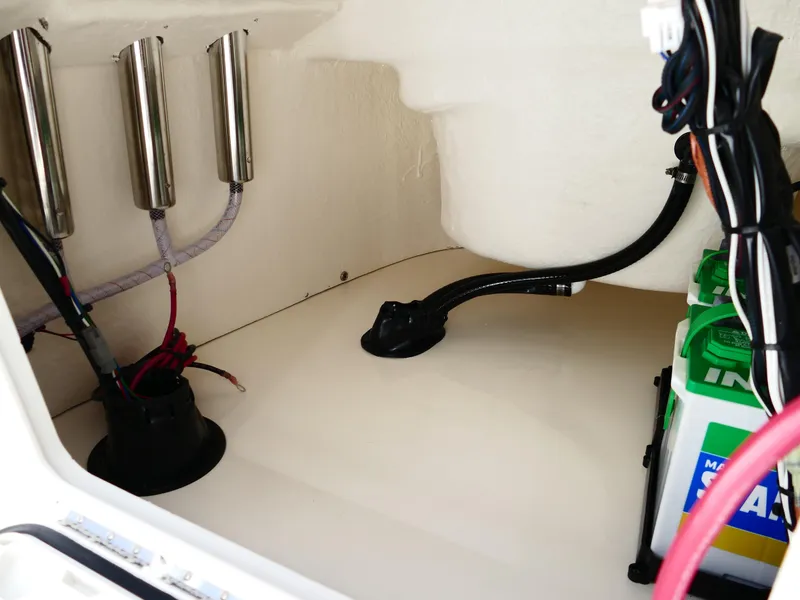 Slide: The Image of 2025 Bulls Bay 2000 boat with open storage compartments on deck. - 30