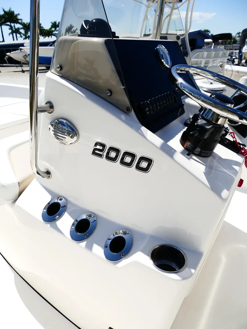 Slide: The Image of Bulls Bay 2000 boat console, 2025 model, featuring steering wheel and control panel. - 38