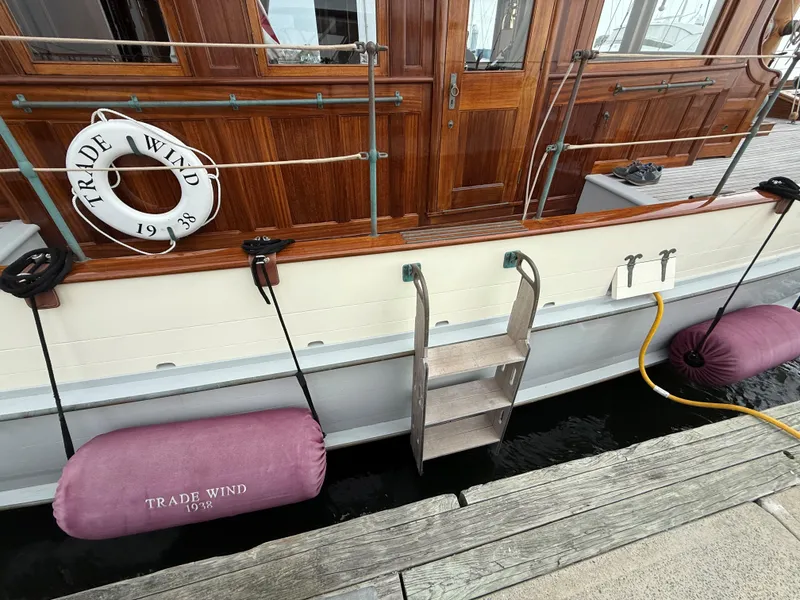 Slide: The Image of Classic 1938 Alden yacht "Trade Wind" with wooden details and dockside view. - 25