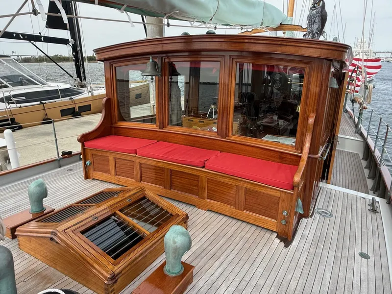 Slide: The Image of Elegant wooden yacht deck with red cushioned seating, Alden Custom Design, 1938, by Rockport Marine. - 32