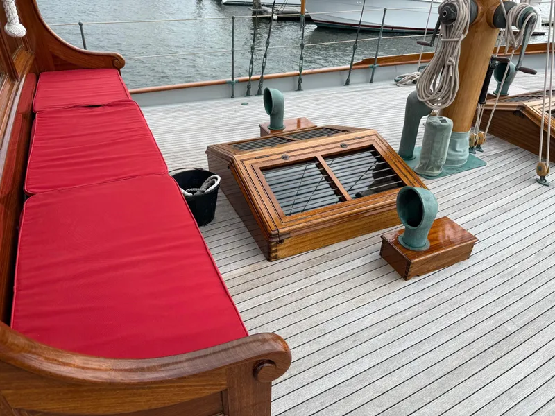 Slide: The Image of Elegant wooden yacht deck with red cushioned seating, vintage design by Alden, Rockport Marine. - 33