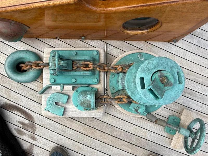Slide: The Image of Vintage ship's anchor windlass on wooden deck, Alden Custom Design, 1938. - 41