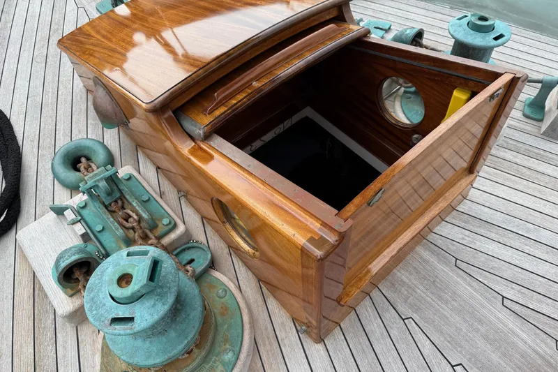 Slide: The Image of Wooden deck hatch on 1938 Alden yacht, featuring vintage marine hardware. - 42