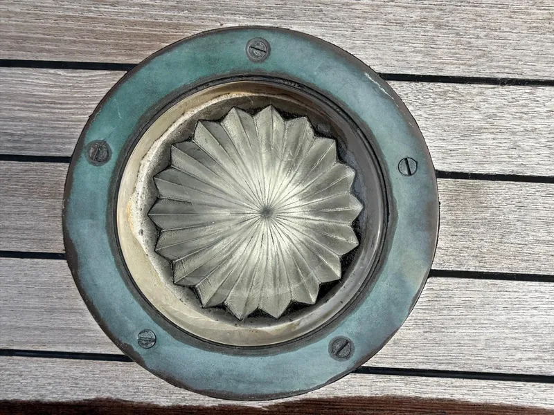 Slide: The Image of Decorative metal vent on wooden deck, Alden Custom Design, 1938, by Rockport Marine. - 46