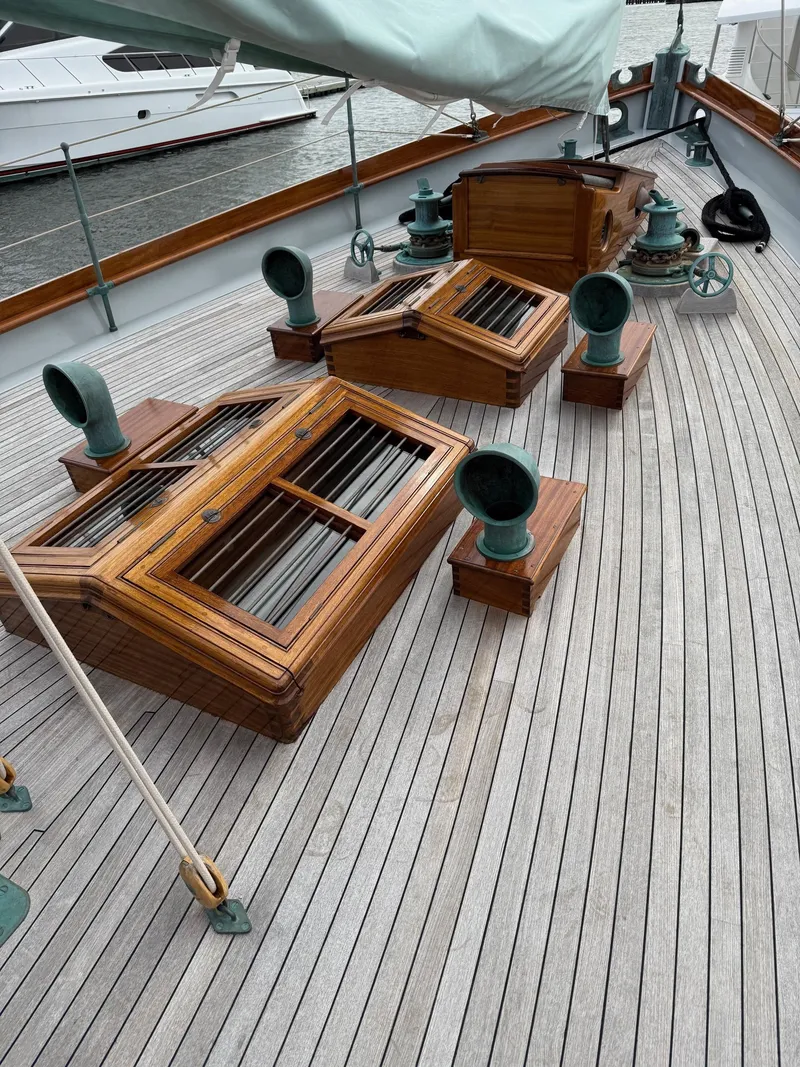 Slide: The Image of Wooden deck of a 1938 Alden yacht, featuring custom design elements and vintage fittings. - 49
