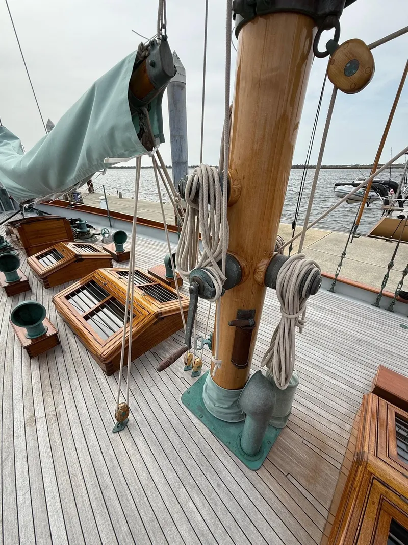 Slide: The Image of Vintage 1938 Alden sailboat deck with wooden mast and rigging, custom design by Rockport Marine. - 50
