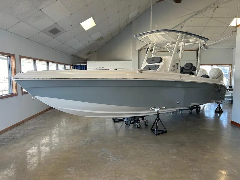 The Image of 2024 Glasstream 28 GSX Pro boat displayed indoors on stands. - 0