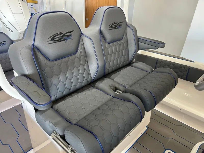 Slide: The Image of 2024 Glasstream 28 GSX Pro boat seats with gray upholstery and blue accents. - 16