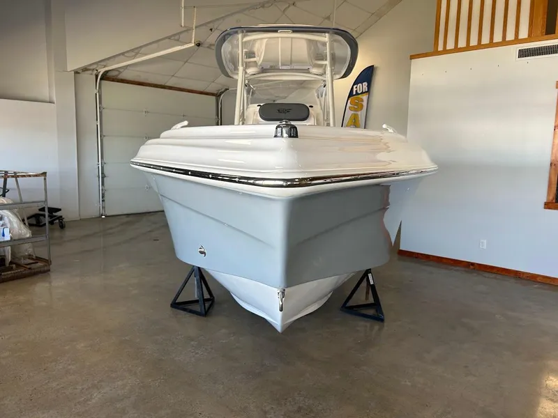 Slide: The Image of 2024 Glasstream 28 GSX Pro boat displayed indoors on stands. - 2