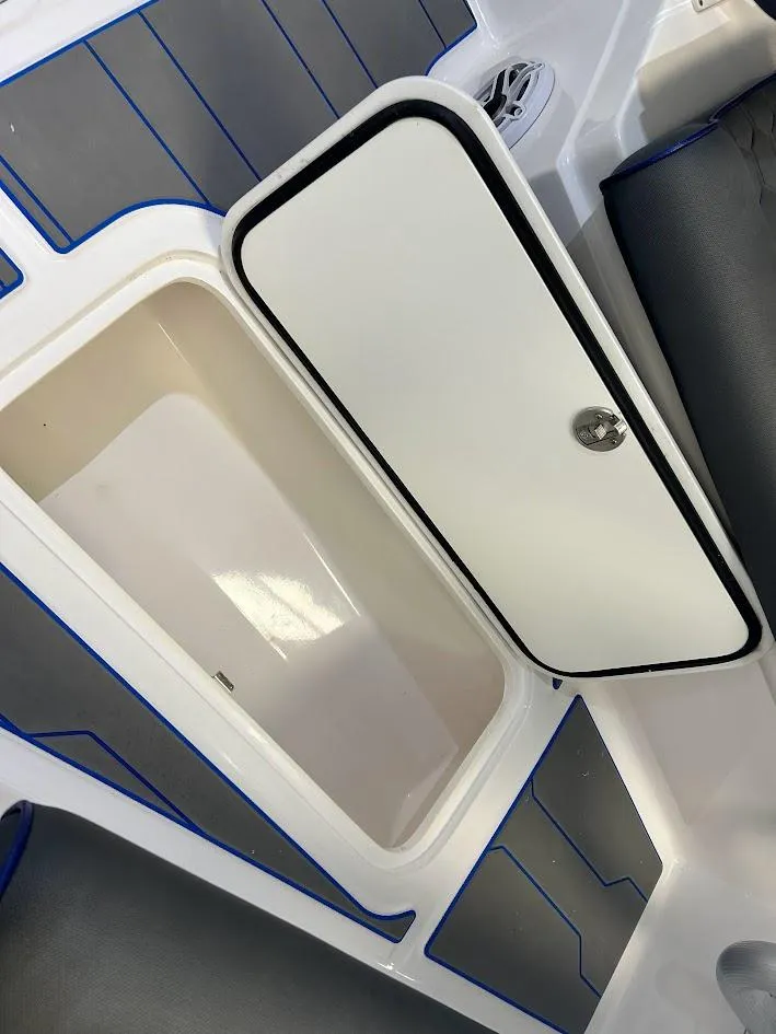 Slide: The Image of 2024 Glasstream 28 GSX Pro boat interior storage compartment with sleek design and modern features. - 24