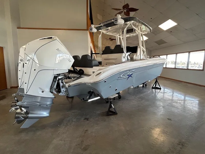 Slide: The Image of 2024 Glasstream 28 GSX Pro boat in showroom, featuring sleek design and powerful engine. - 6