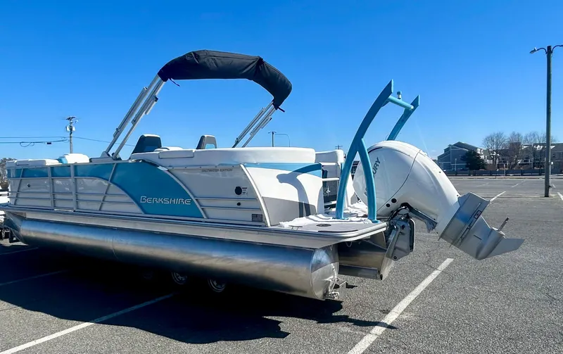 Slide: The Image of 2025 Berkshire 23RFX STS 3.0 pontoon boat in parking lot, sunny day. - 4