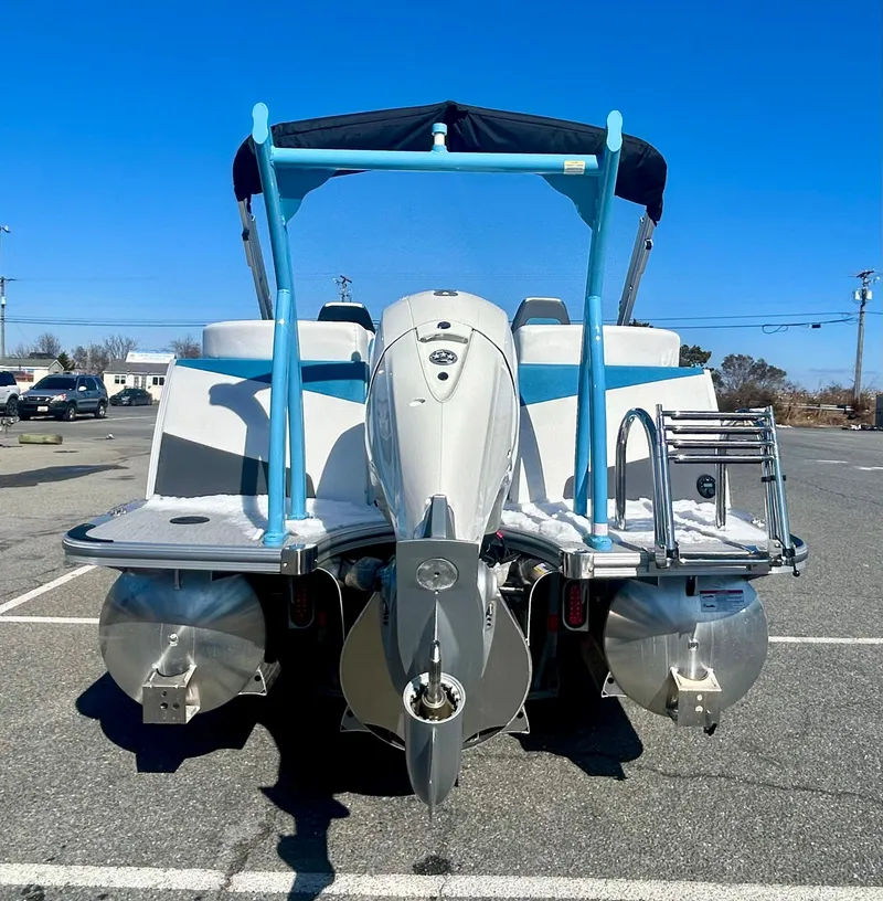 Slide: The Image of 2025 Berkshire 23RFX STS 3.0 pontoon boat, rear view in parking lot. - 9