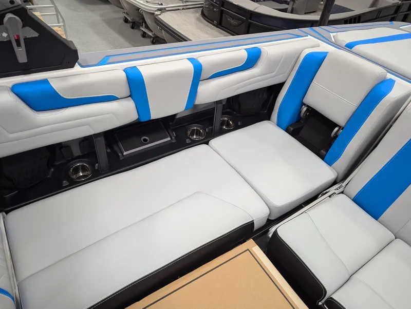 Slide: The Image of 2025 Malibu Wakesetter 25 LSV interior with blue and white seating. - 12