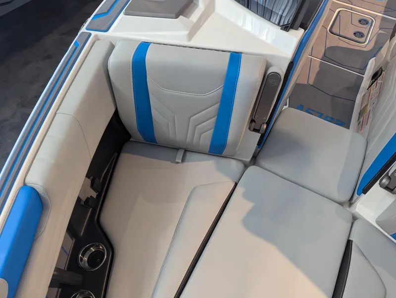 Slide: The Image of 2025 Malibu Wakesetter 25 LSV interior with blue and gray seating design. - 16