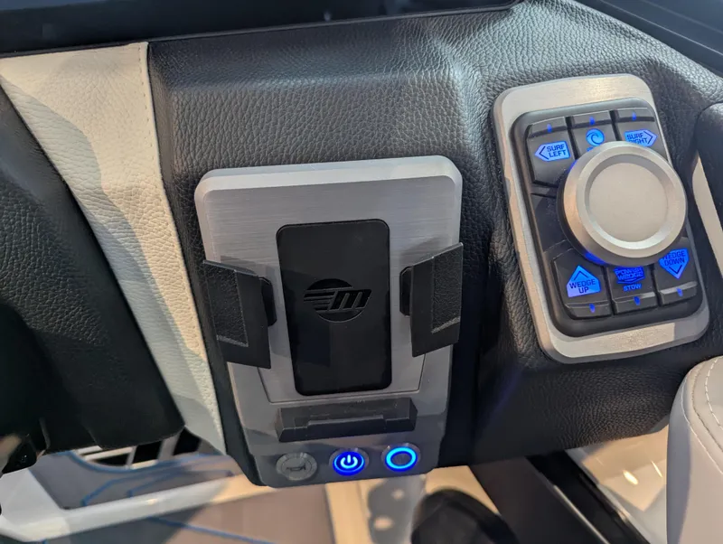 Slide: The Image of Control panel of 2025 Malibu Wakesetter 25 LSV boat with illuminated buttons. - 18