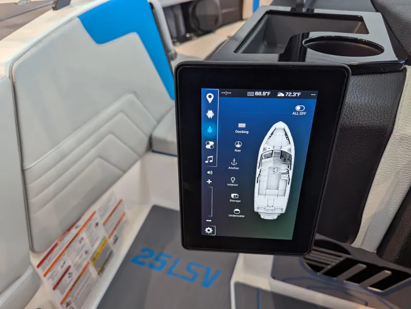 Slide: The Image of 2025 Malibu Wakesetter 25 LSV interior with touchscreen control panel and seating. - 21