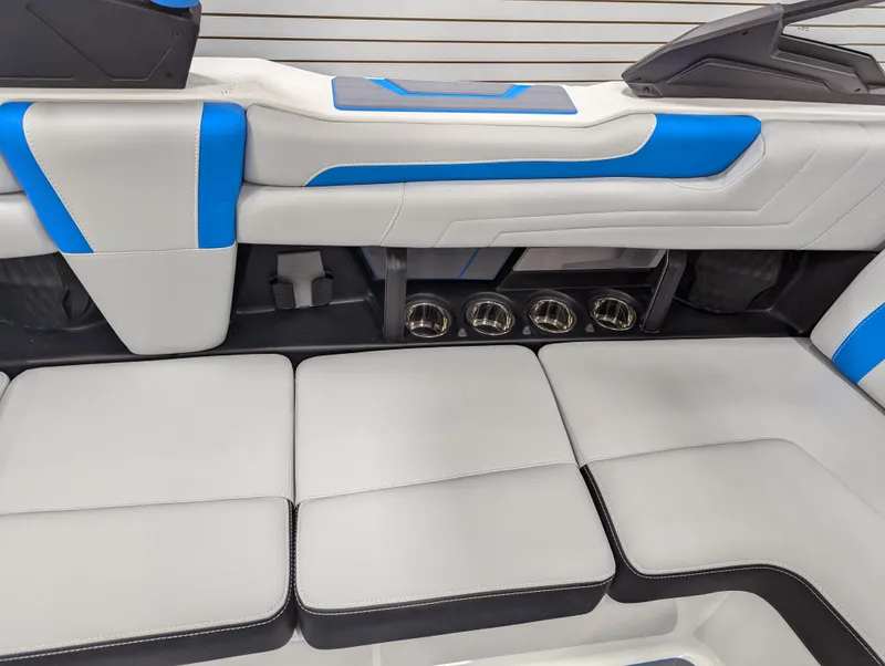 Slide: The Image of Interior seating of 2025 Malibu Wakesetter 25 LSV with blue and white upholstery. - 9