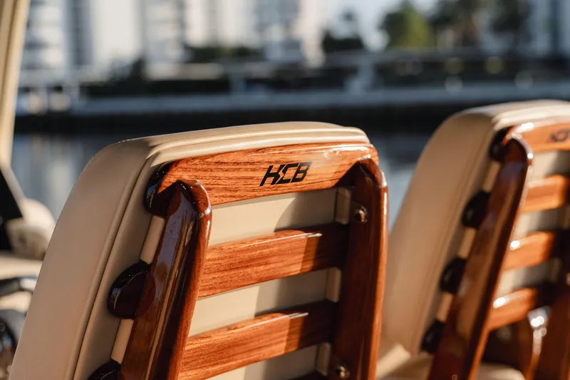 Slide: The Image of Luxury seating on 2022 HCB 53 Sueños boat with wooden accents. - 22