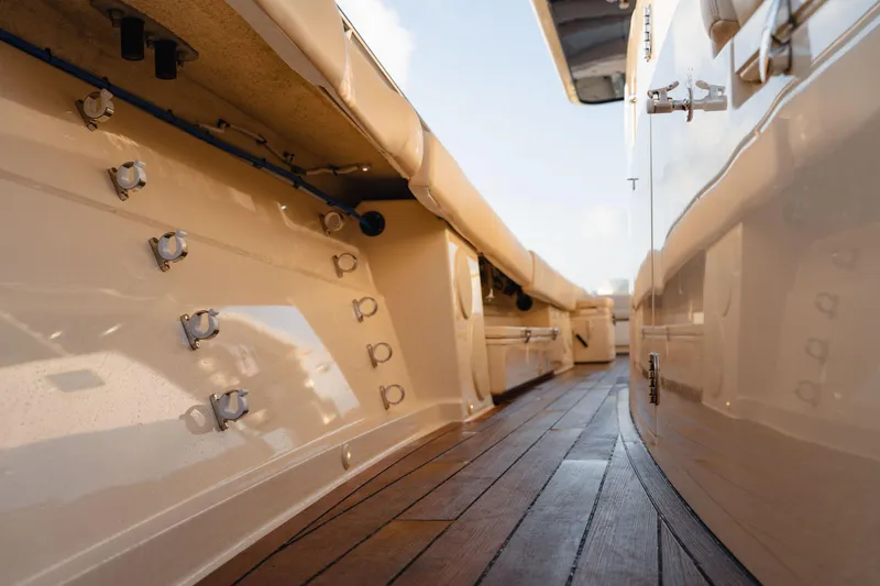 Slide: The Image of 2022 HCB 53 Sueños boat deck with sleek design and wooden flooring. - 28