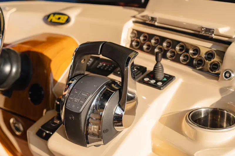 Slide: The Image of Control panel of 2022 HCB 53 Sueños boat with throttle and switches. - 29