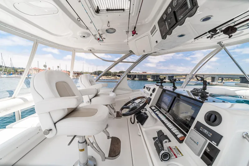 Slide: The Image of Interior view of 2008 Sea Ray 58 Sedan Bridge yacht cockpit with navigation equipment. - 17