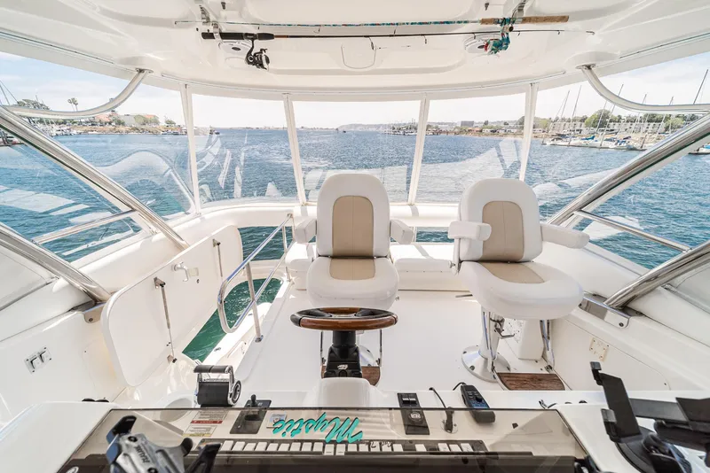 Slide: The Image of 2008 Sea Ray 58 Sedan Bridge helm with panoramic ocean view. - 18