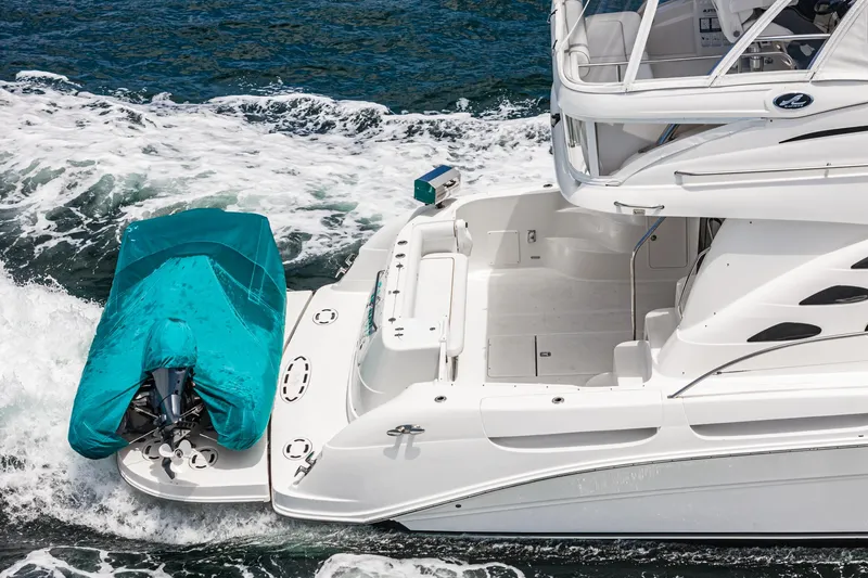 Slide: The Image of 2008 Sea Ray 58 Sedan Bridge yacht cruising with covered tender. - 21