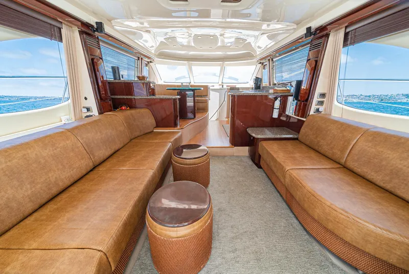 Slide: The Image of Luxurious interior of 2008 Sea Ray 58 Sedan Bridge yacht with elegant seating and panoramic windows. - 26