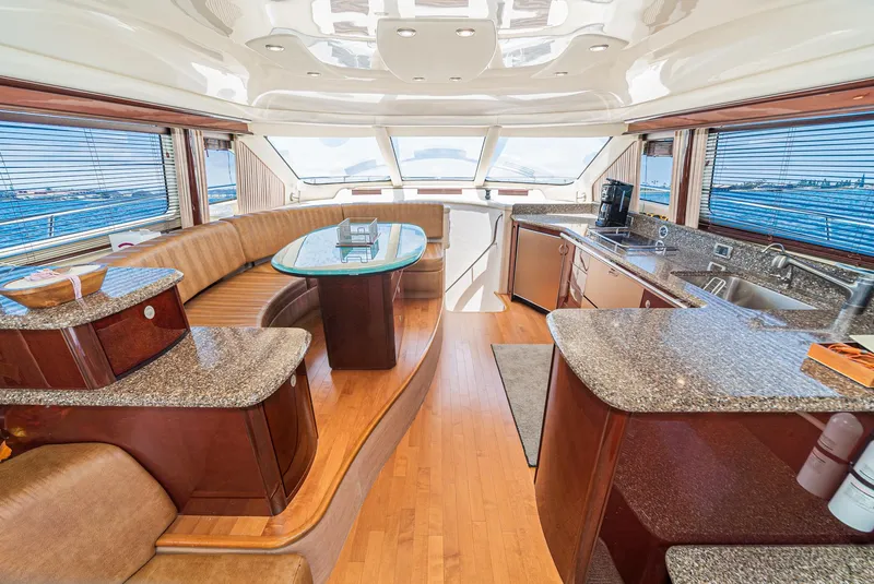 Slide: The Image of Luxurious interior of 2008 Sea Ray 58 Sedan Bridge yacht with modern kitchen and seating area. - 27